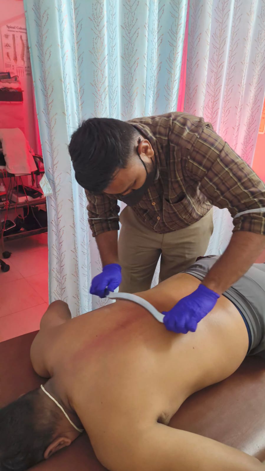 IASTM therapy tools for muscle release at Spine-X Chiropractic