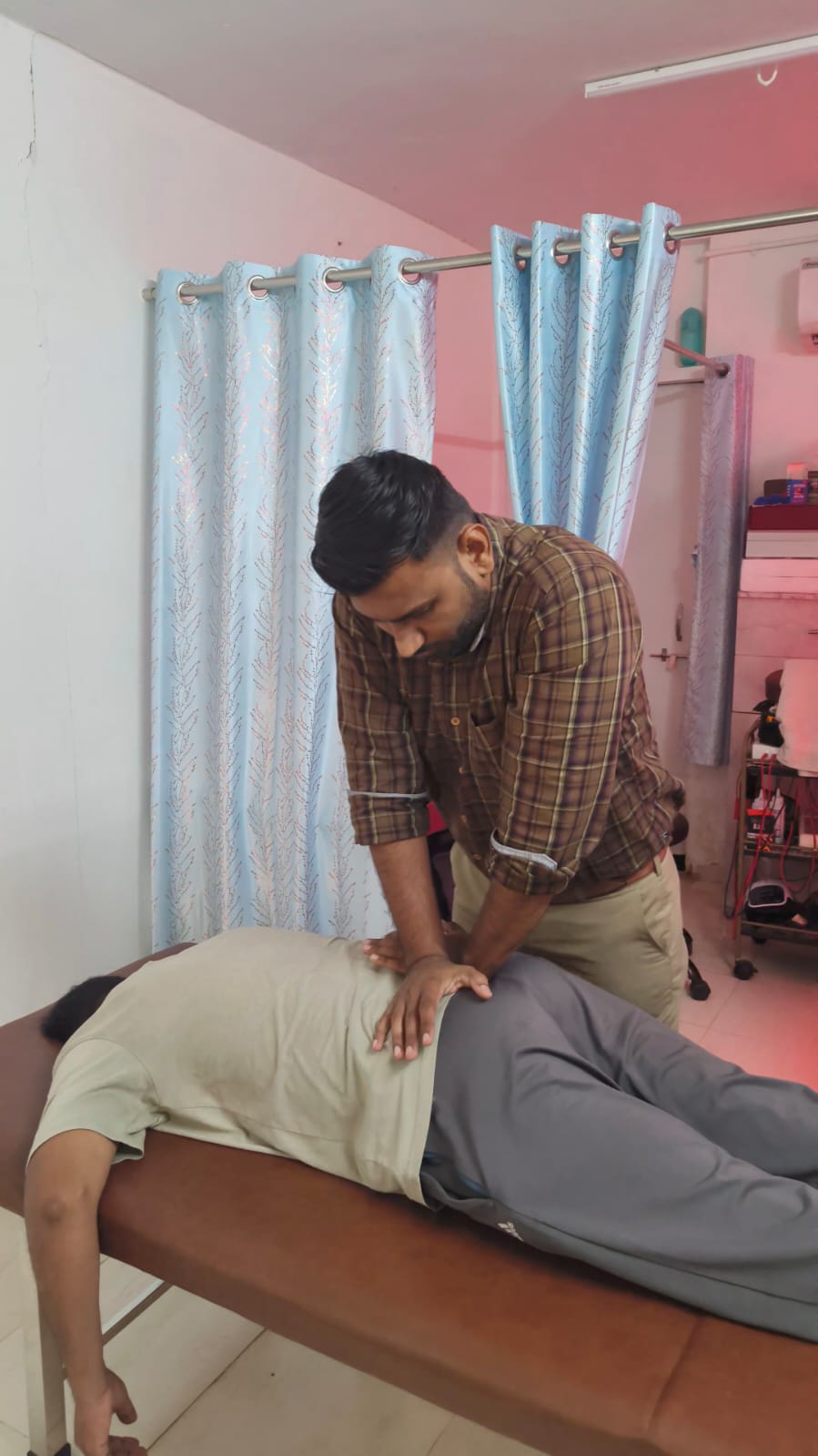 Patient receiving massage therapy at Spine-X Chiropractic