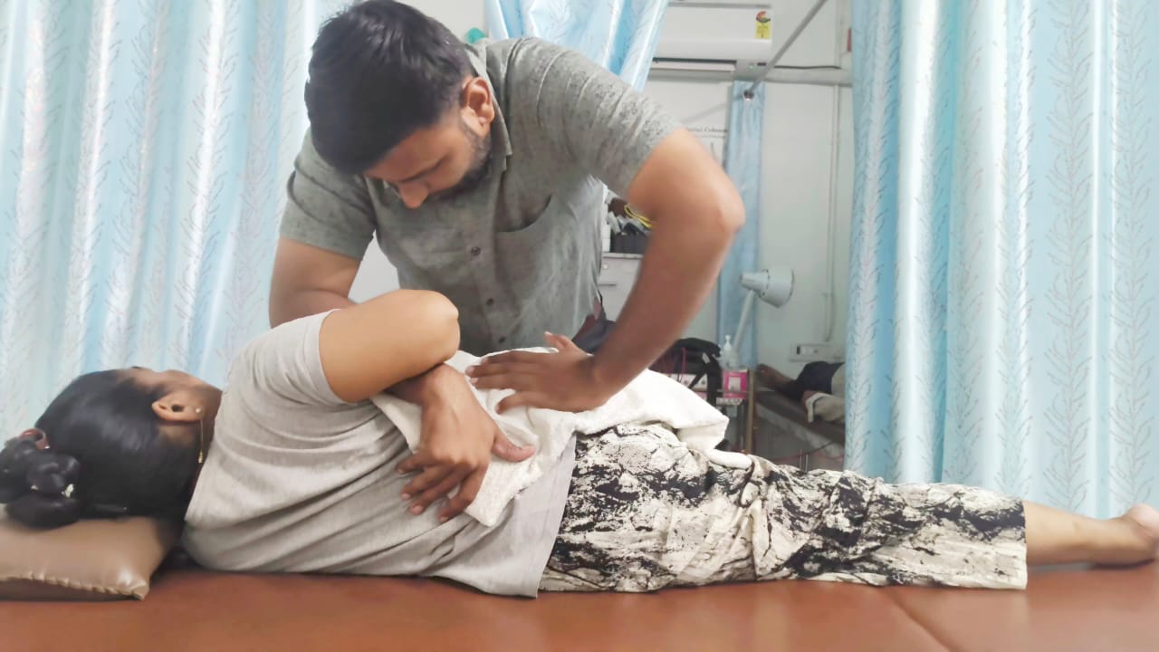 Professional chiropractic adjustment in progress at Spine-X Chiropractic